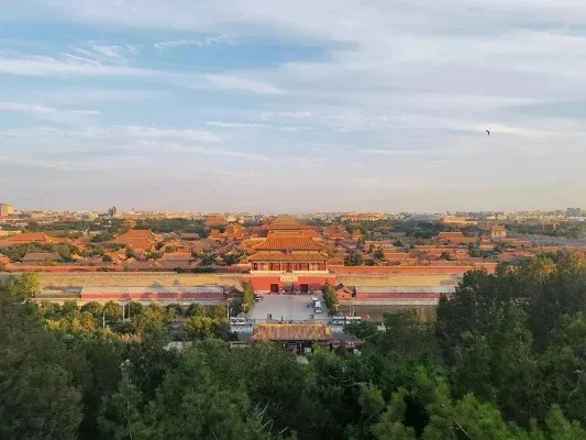 Jingshan Park panoramic view over the Forbidden City rooftops at sunset