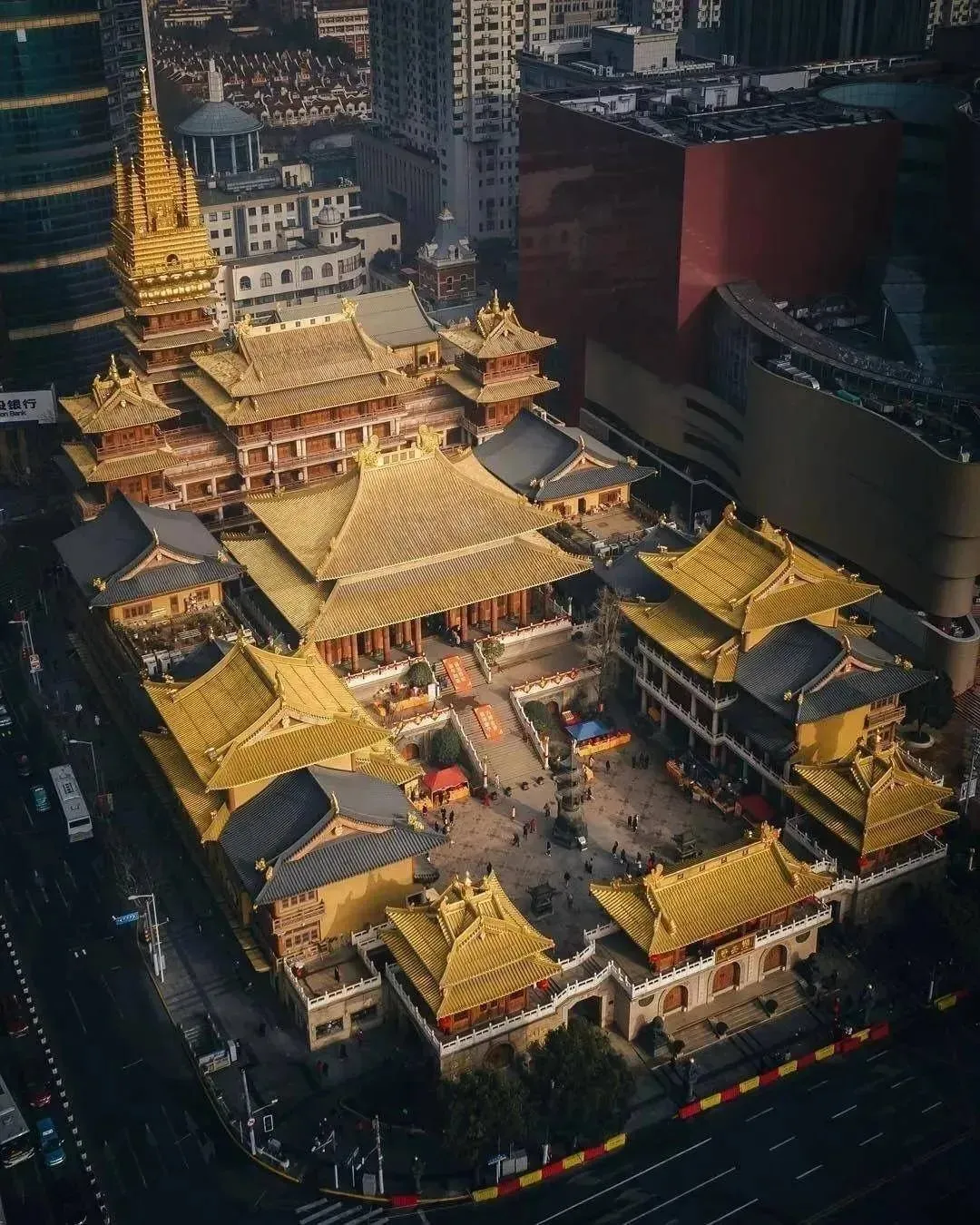 Jing'an Temple golden rooftop complex surrounded by modern skyscrapers