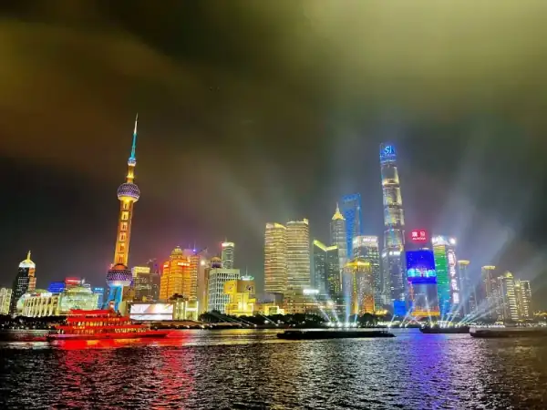 The Bund waterfront at night with colonial buildings and Pudong skyline