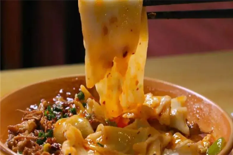 Biangbiang noodles thick hand-pulled wheat noodles with chili oil and minced meat