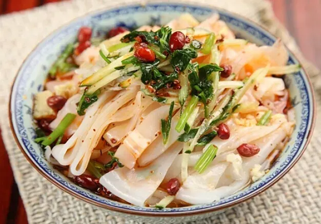 Liangpi cold rice noodle salad with chili oil and bean sprouts